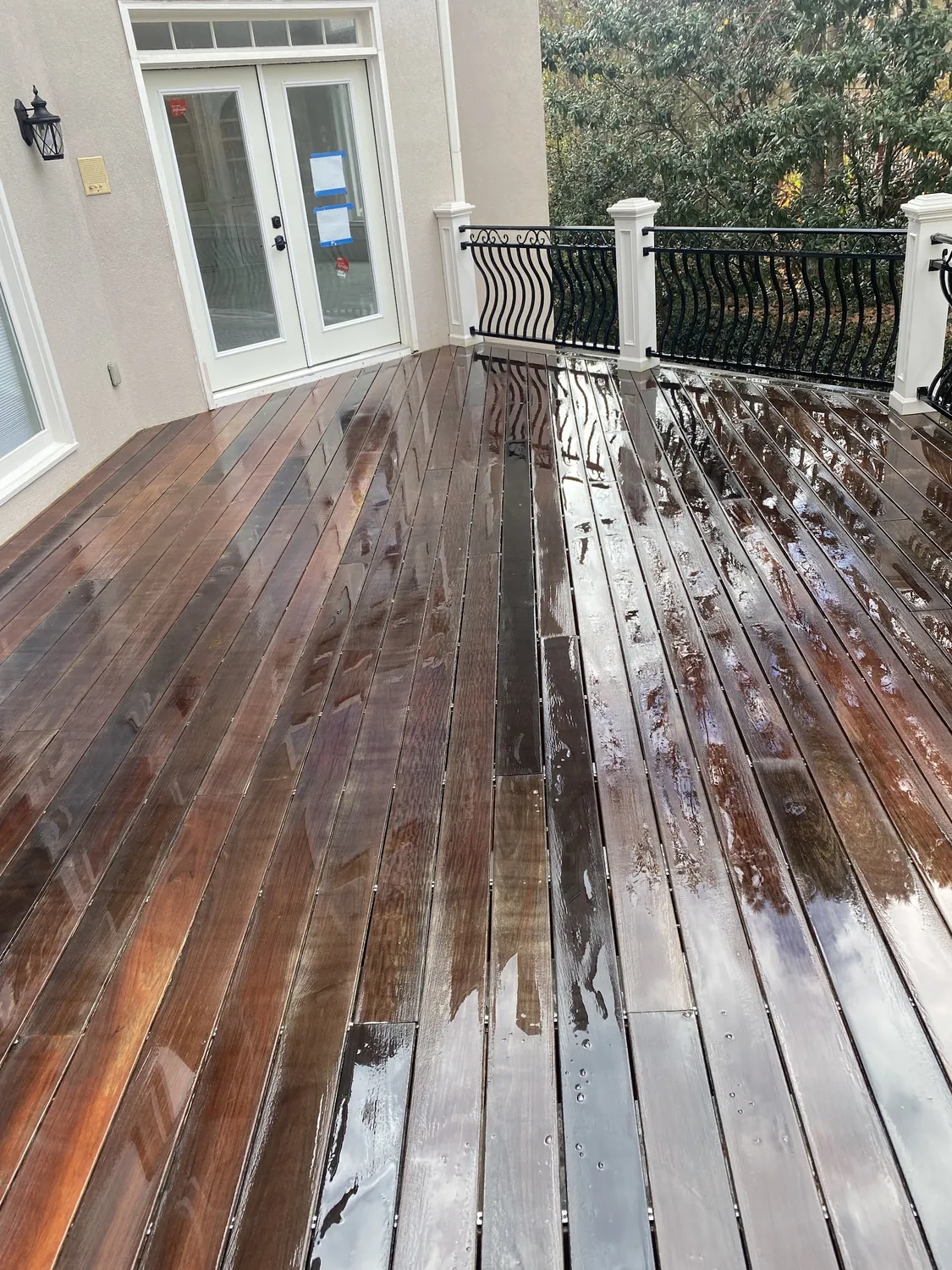 A wet hardwood deck after cleaning